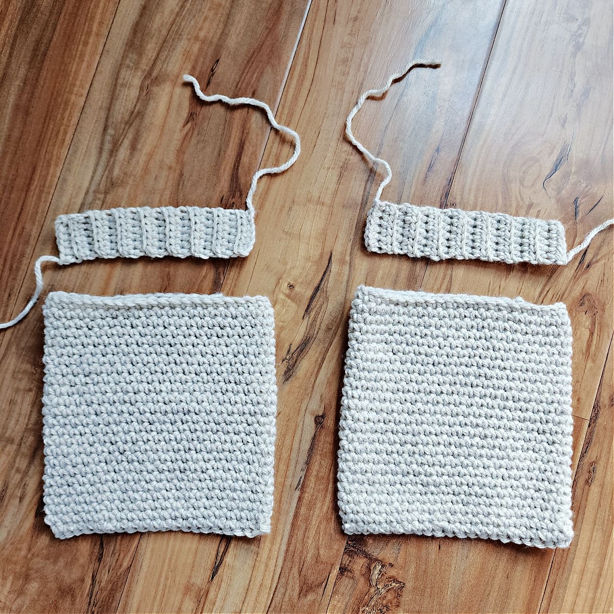 Crochet pocket pouches with ribbing for inset pockets.