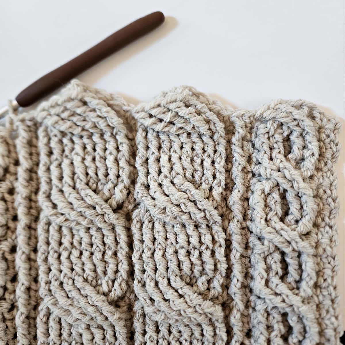 One narrow crochet cable and two wide crochet cables complete for cardigan.