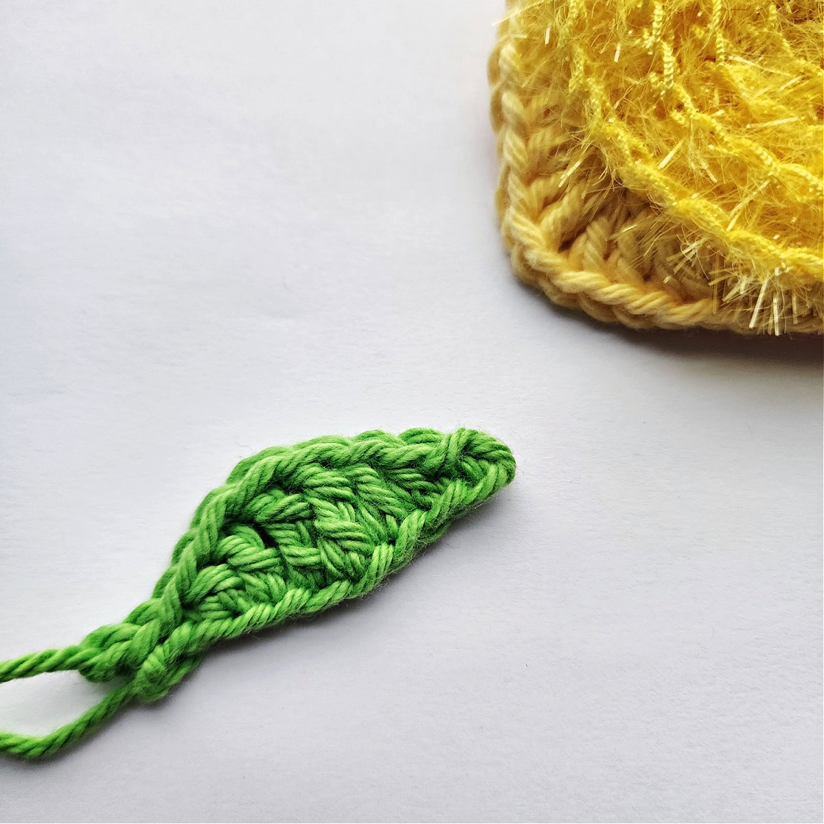 Green crochet lemon leaf.