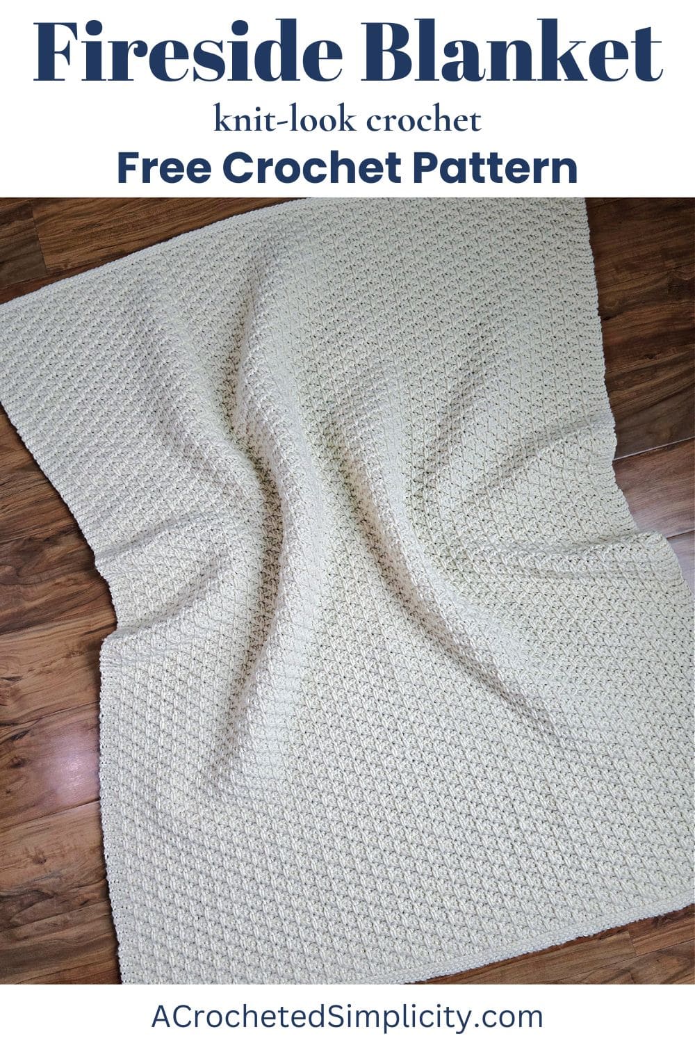 A cream colored textured crochet blanket laying on a wood floor.