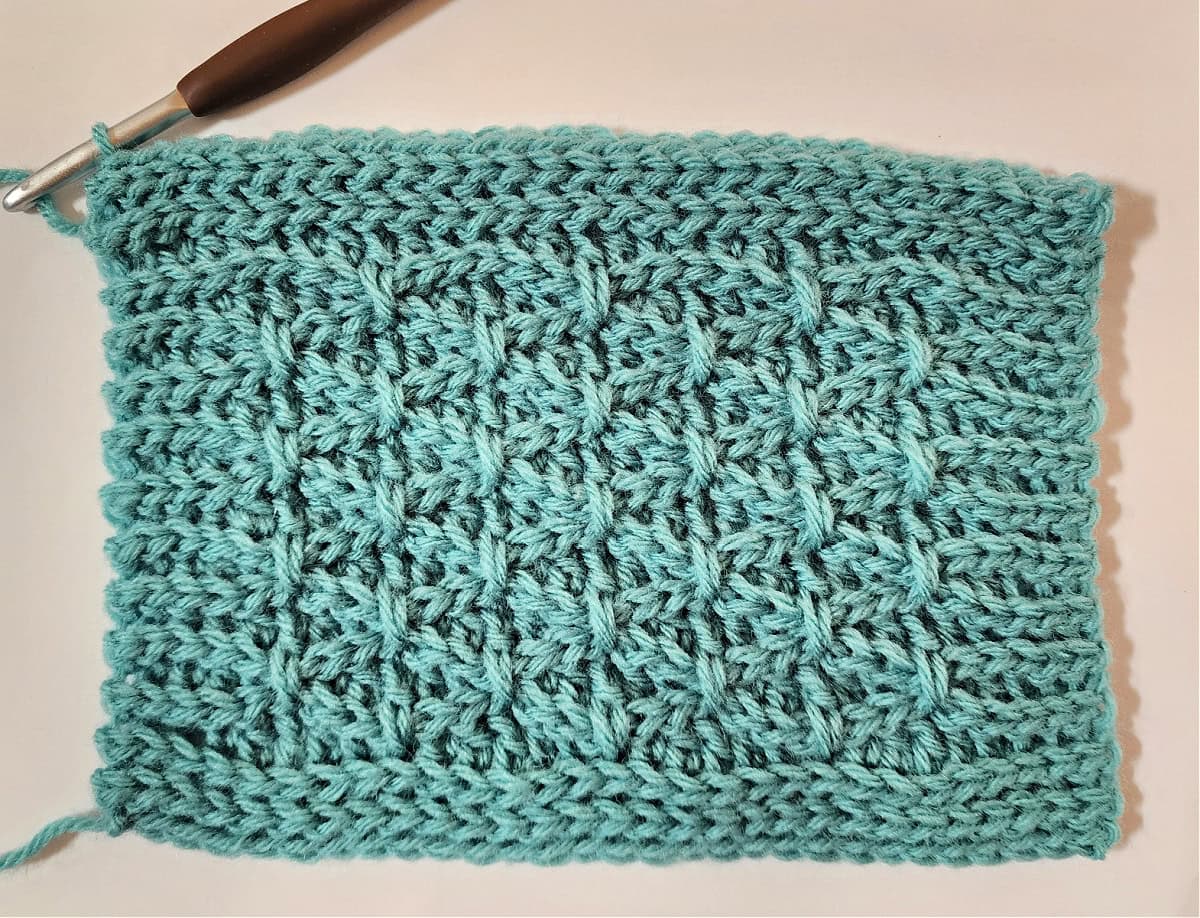 A small green swatch complete for a knit-look crochet blanket.