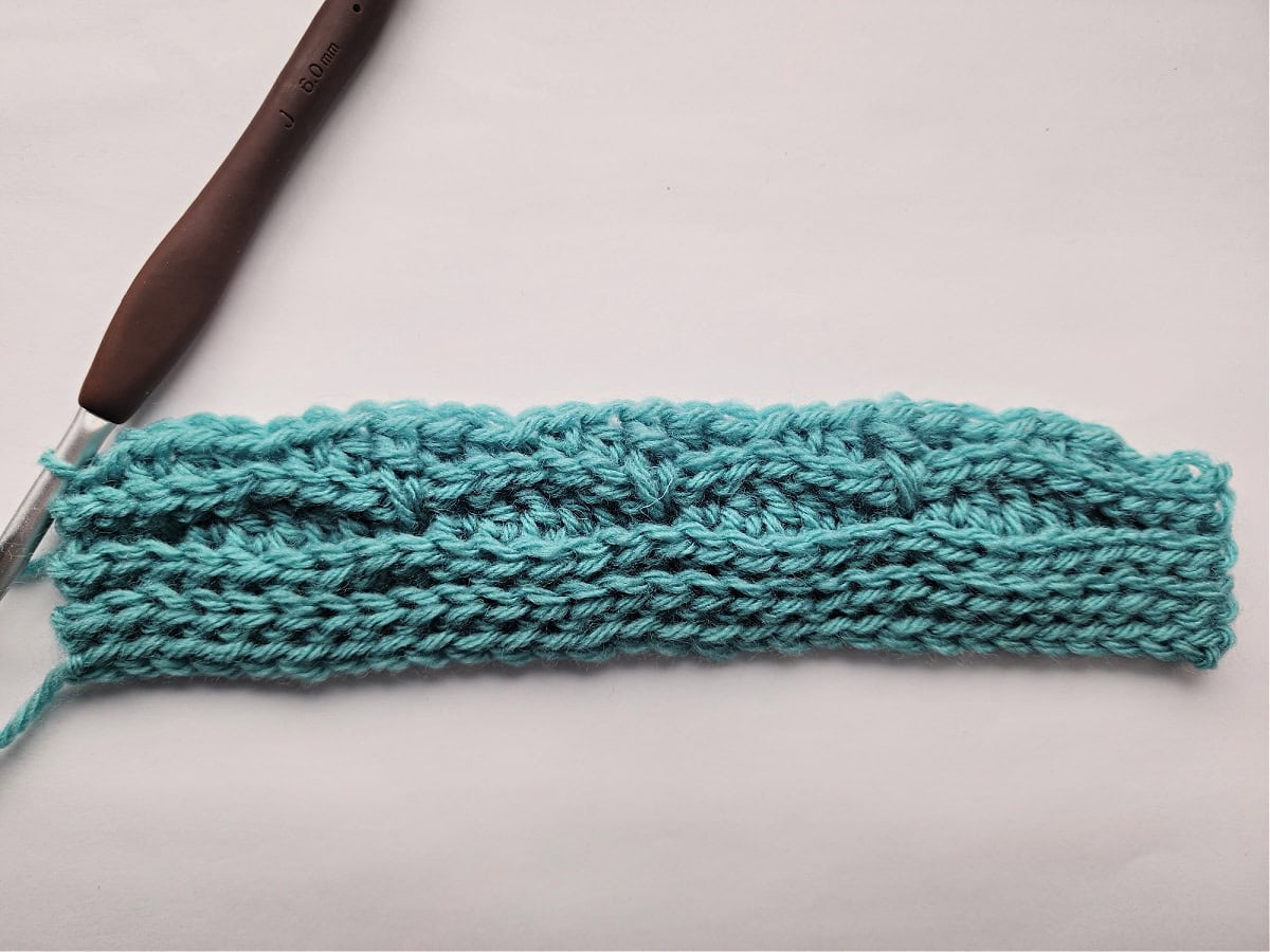 Seven rows of a knit-look crochet swatch for a blanket.