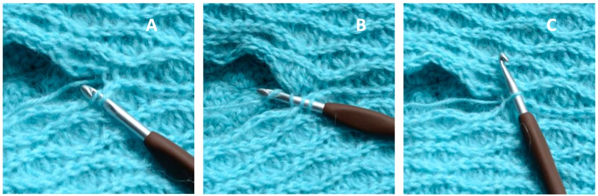 A crochet hook inserted into a stitch of a crochet project to create a slip stitch seam.