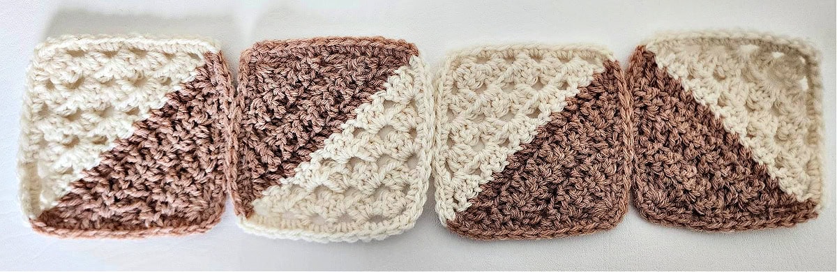 Four crochet granny square motifs lined up.