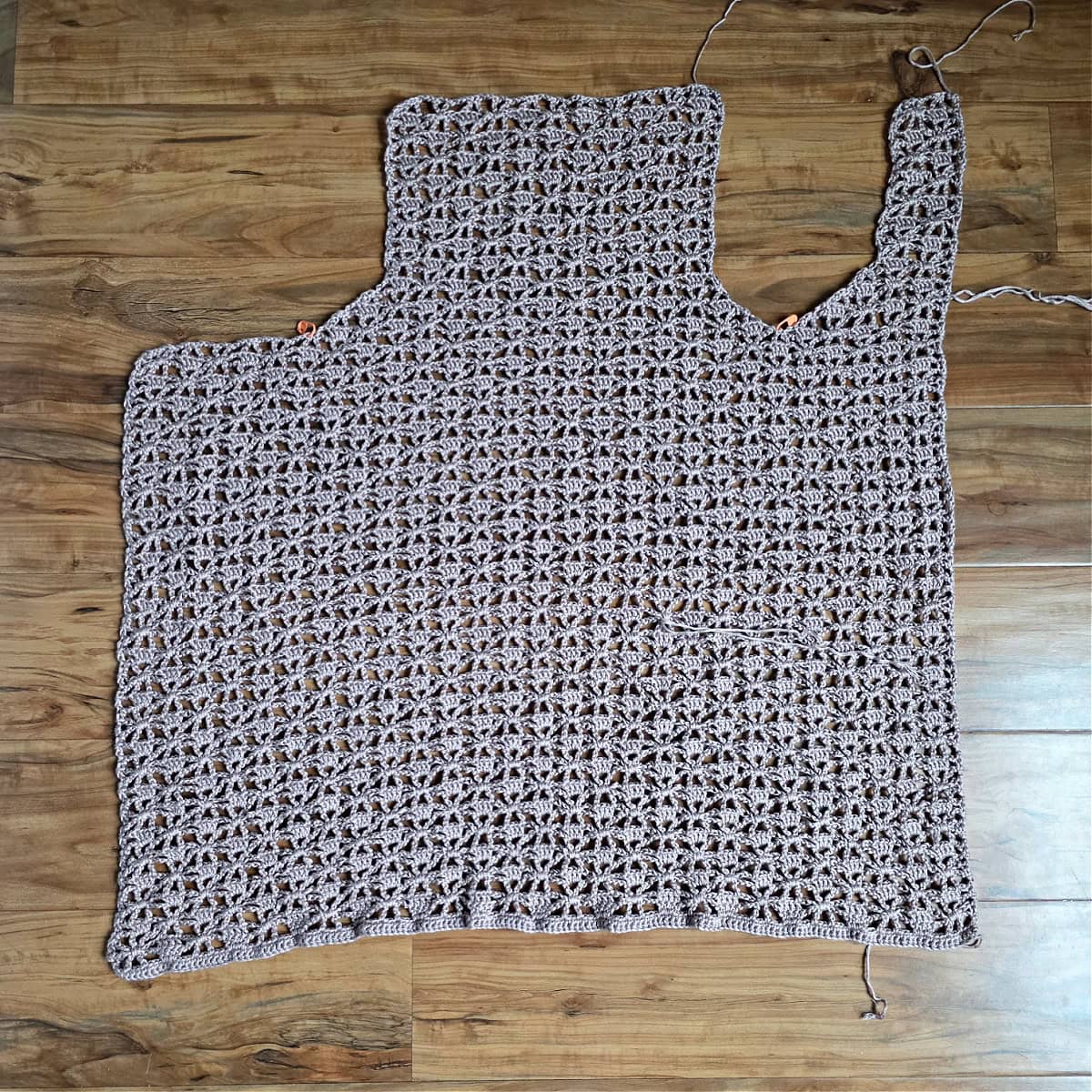 The body of the crochet vest, front right panel, and back panel complete.