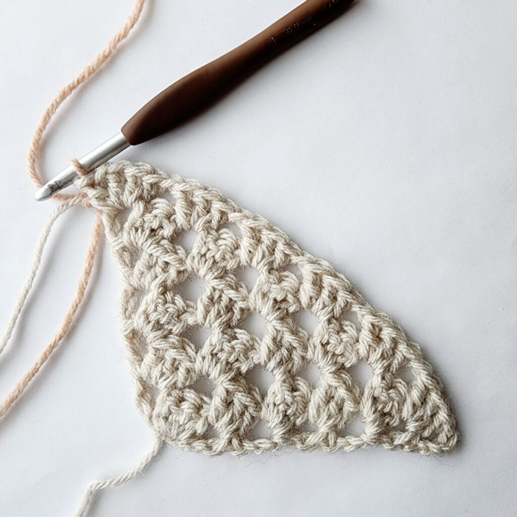 Sixth row of increase of a crochet granny square motif.
