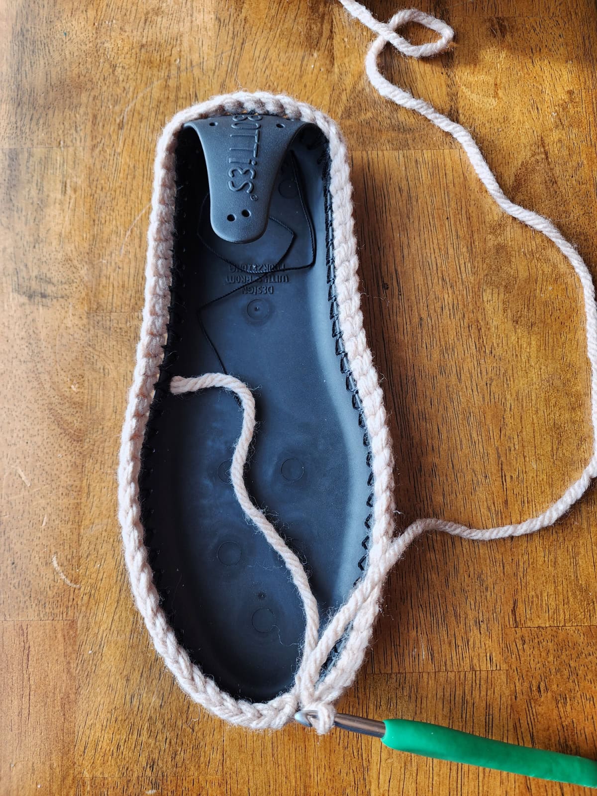 Working the toe and top of foot of the crochet slipper boot.