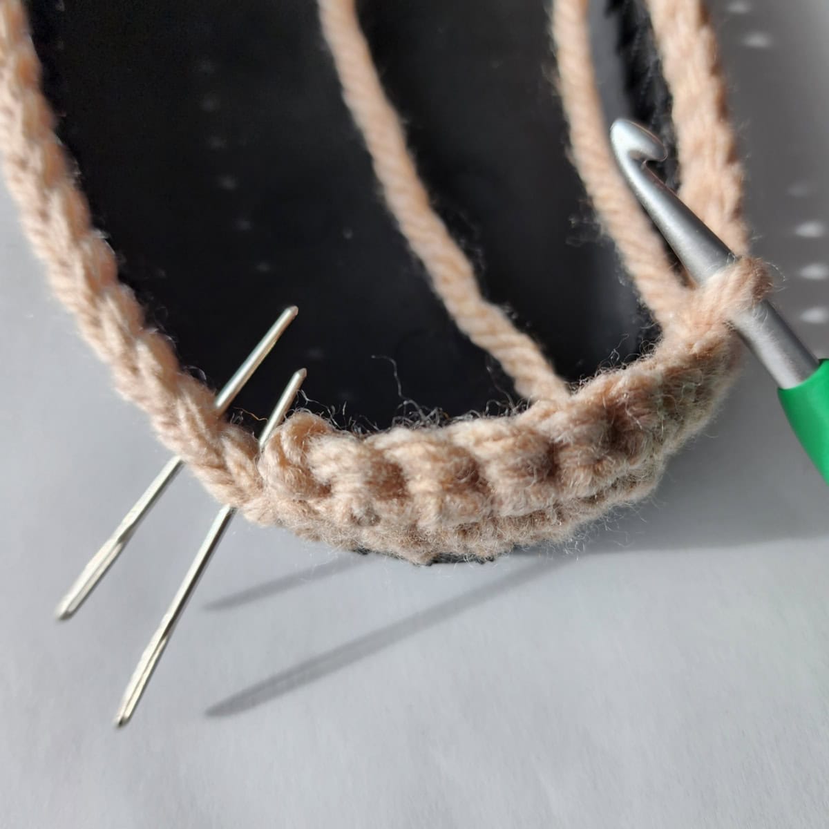 Working the toe and top of foot of the crochet slipper boot.