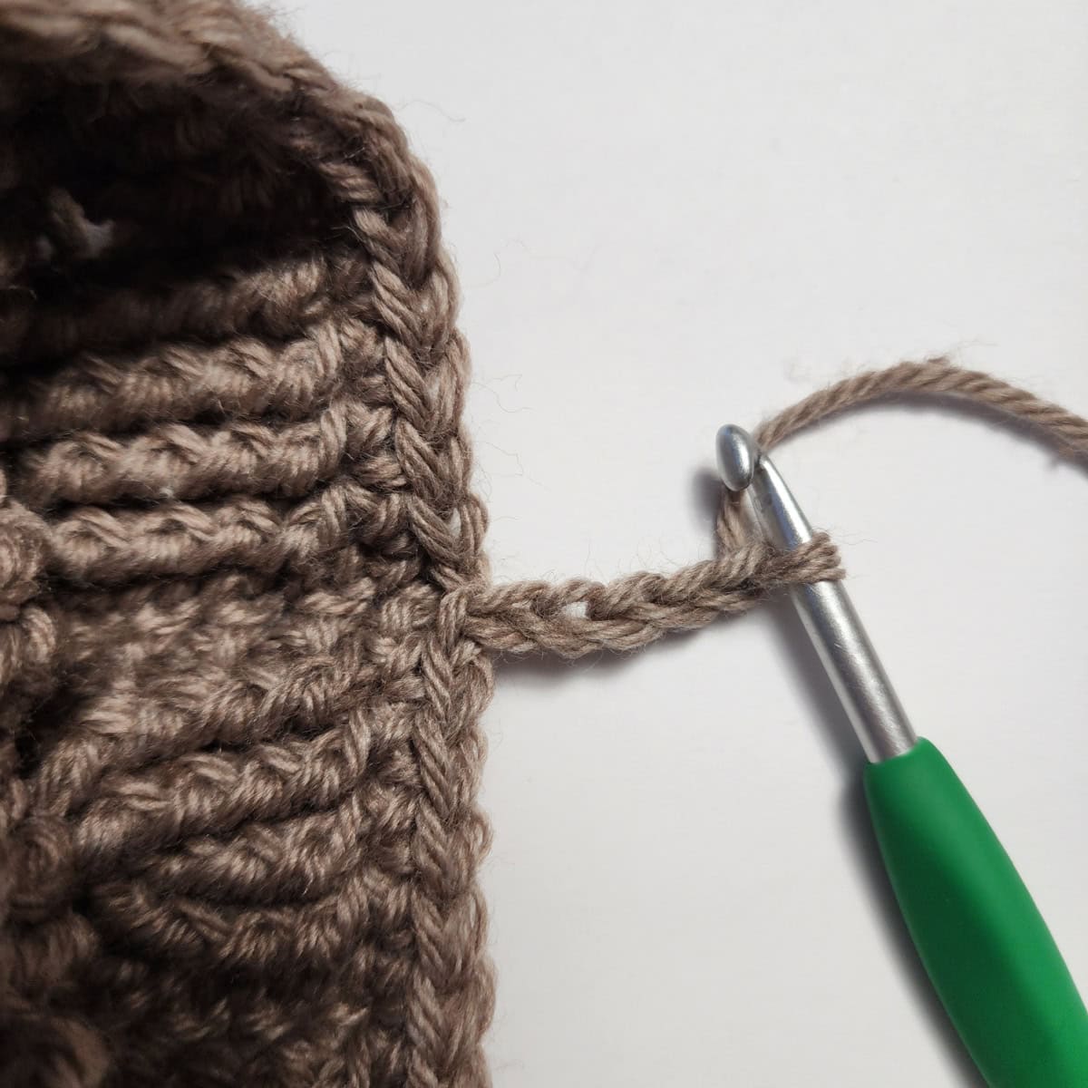 Working the cuff ribbing of the crochet slipper boot.
