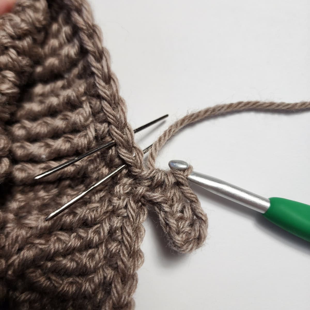 Working the cuff ribbing of the crochet slipper boot.