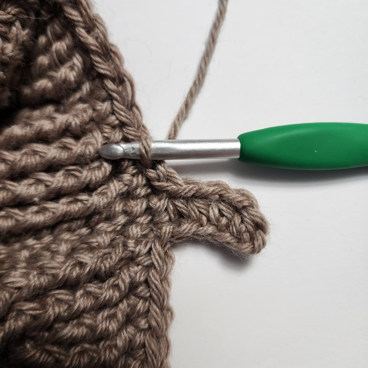 Working the cuff ribbing of the crochet slipper boot.