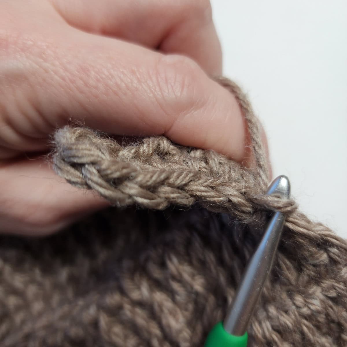 Working the cuff ribbing of the crochet slipper boot.