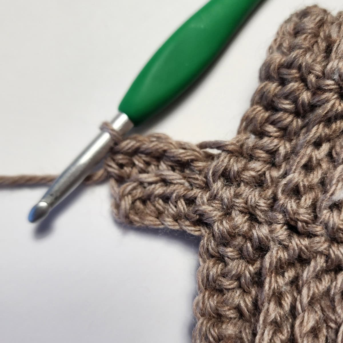 Working the cuff ribbing of the crochet slipper boot.