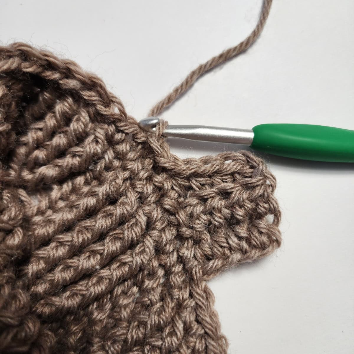 Working the cuff ribbing of the crochet slipper boot.