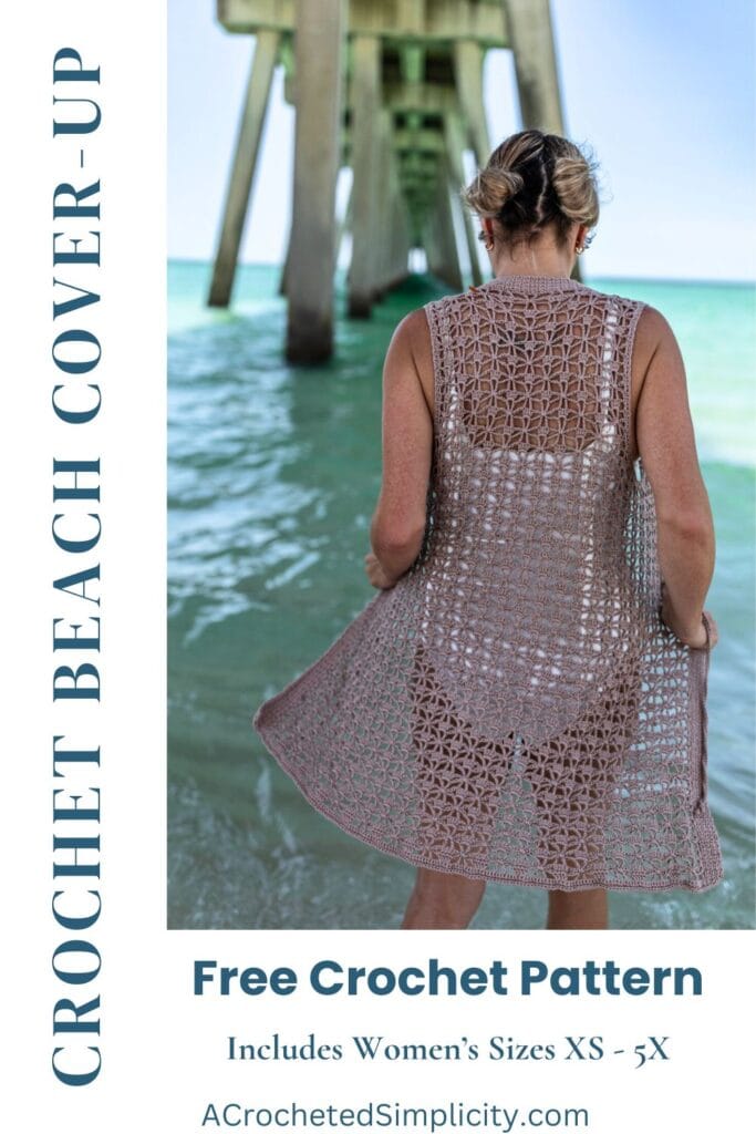 Woman standing in the ocean wearing a white swimsuit and crochet swim cover up.