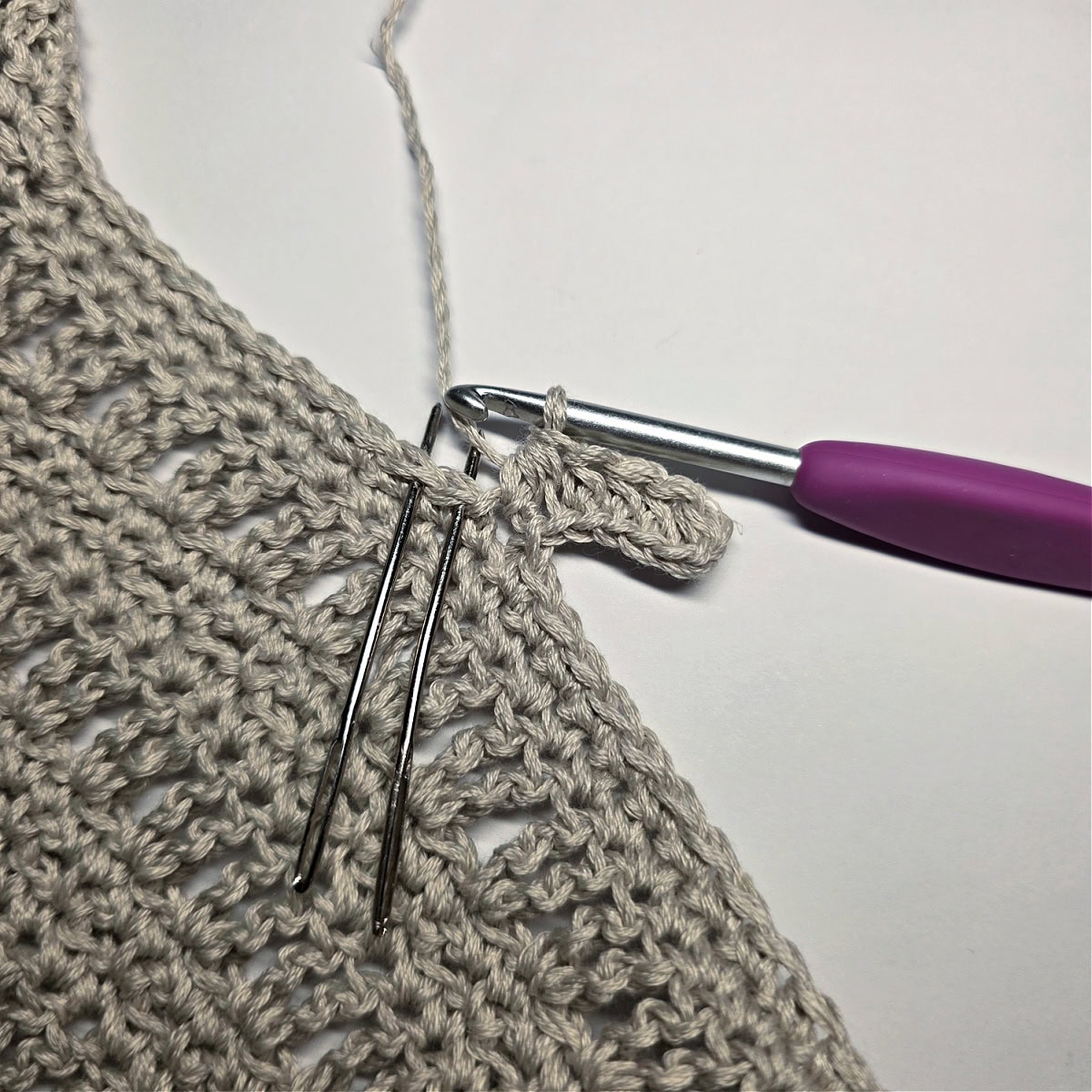 Completed Row 1 of the Neck Ribbing of the crochet tank top.