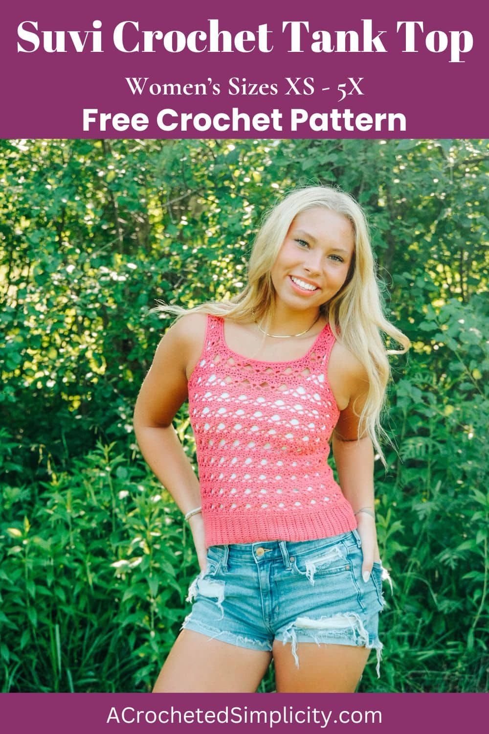 Woman wearing a red crochet tank top and blue denim shorts with trees in her background.