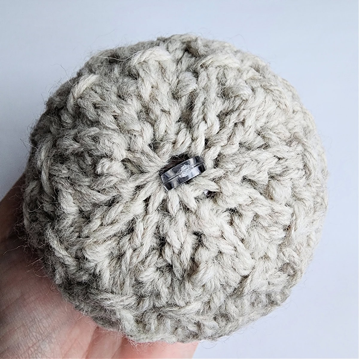 The top of a handmade crochet ornament.