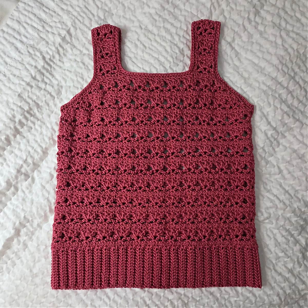 Completed red crochet tank top.