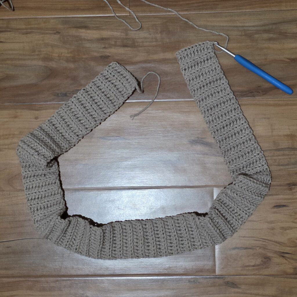 Crochet waistband against a wooden background.