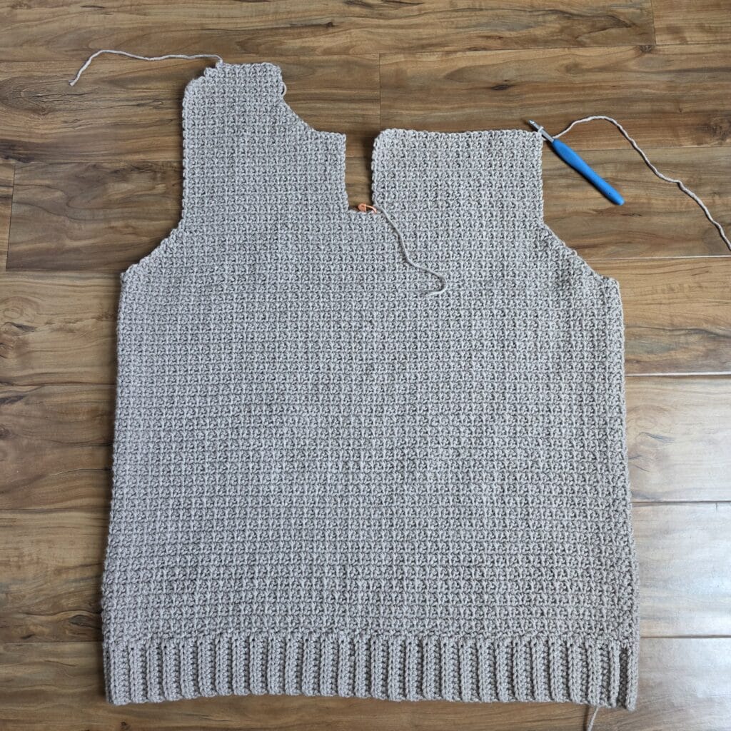 Working the upper left panel of the crochet sweater.