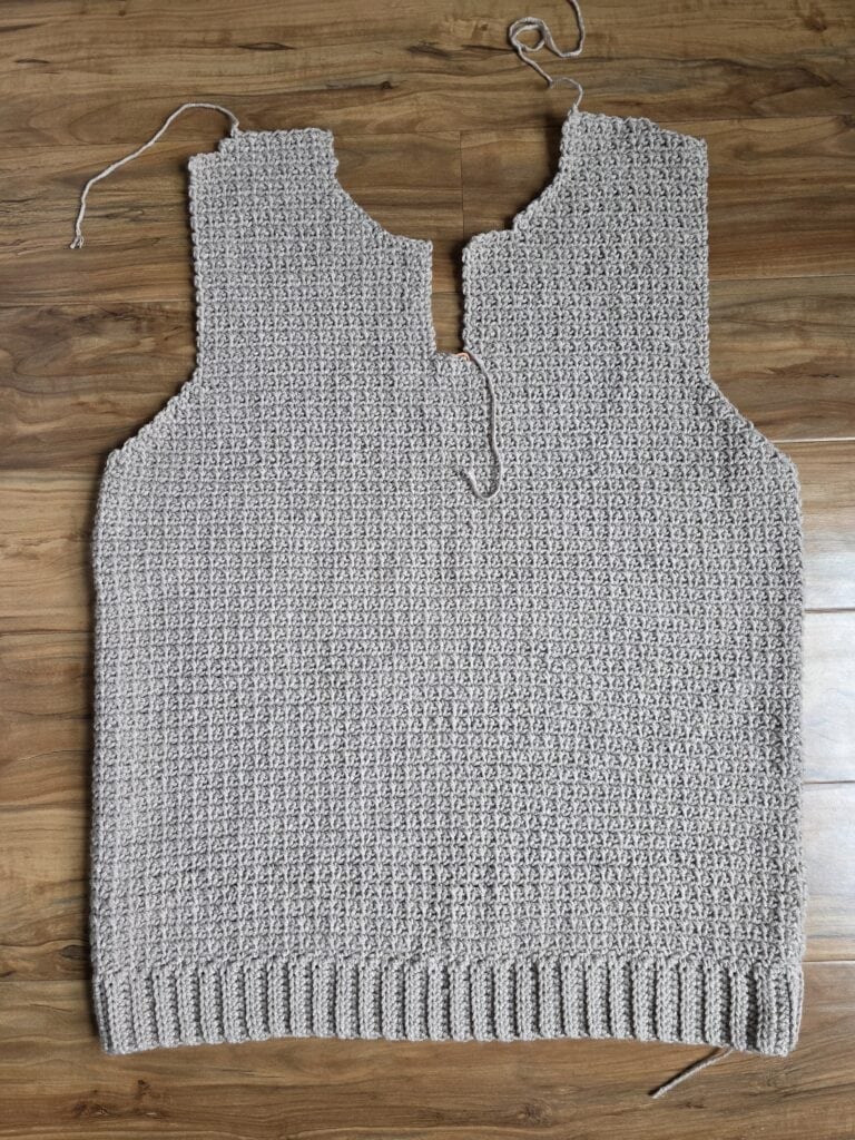 Completed front panels of the men's crochet sweater.