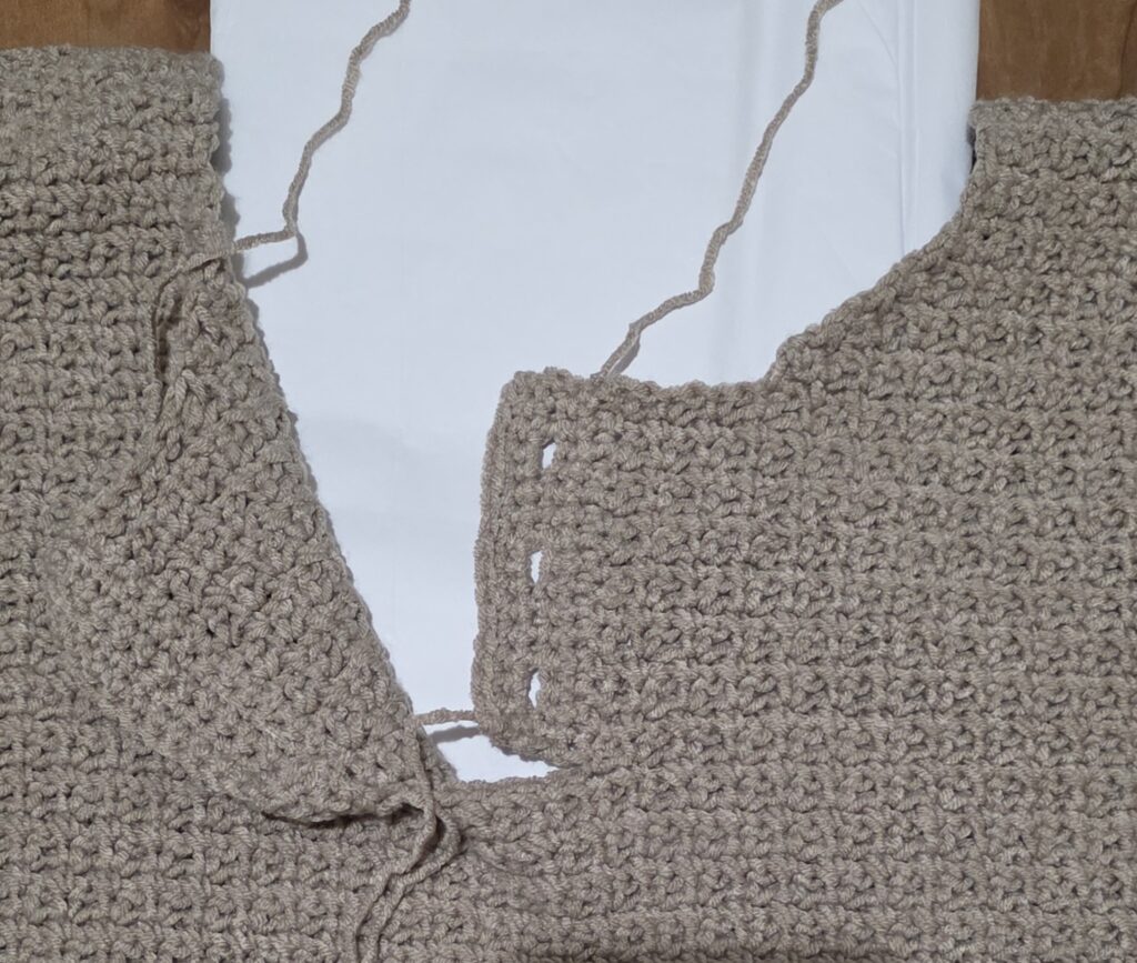 Completed buttonhole flap of the crochet sweater.