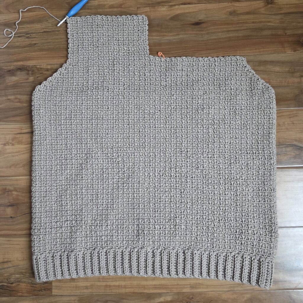 Working the upper right panel of the crochet sweater.