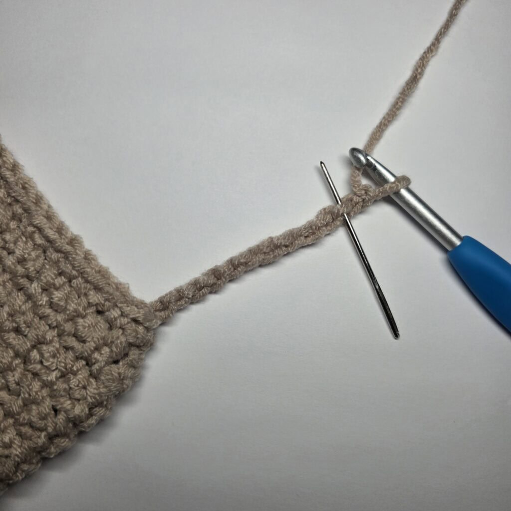 Row 1 of the cuff ribbing for the crochet sweater.