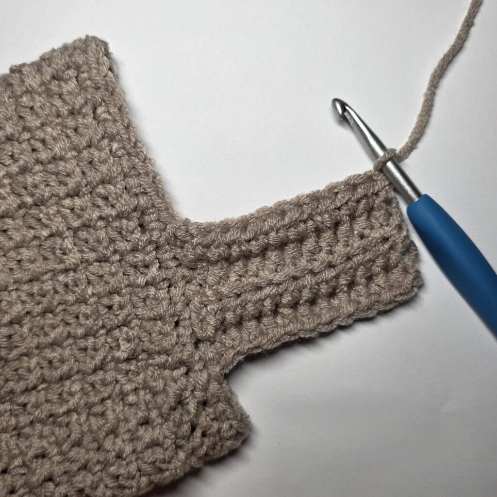 Row 4 of the cuff ribbing for the crochet sweater.