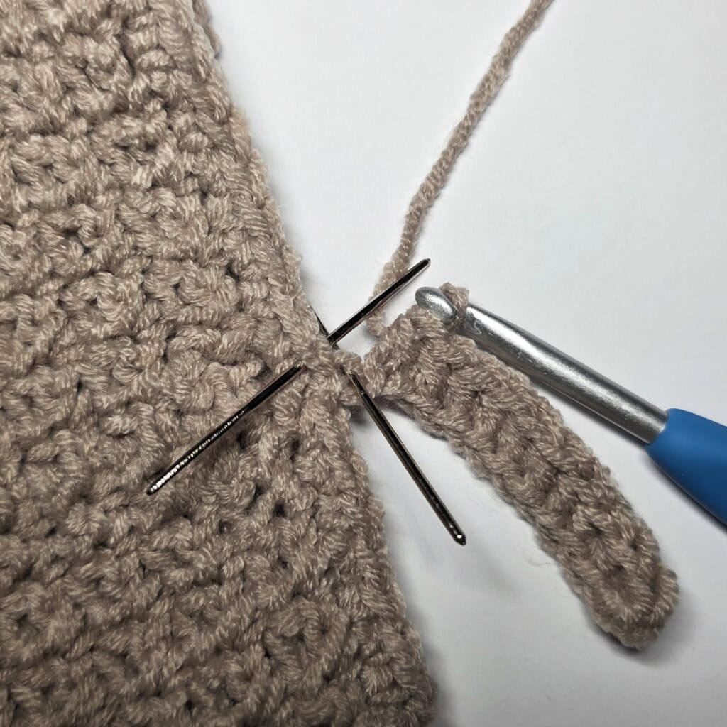 Row 1 of the cuff ribbing for the crochet sweater.