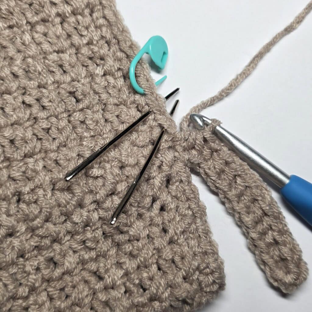 Row 1 of the cuff ribbing for the crochet sweater.
