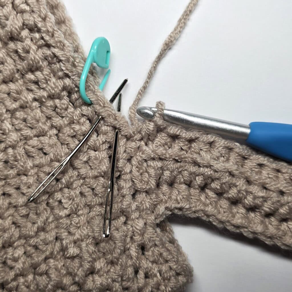 Starting Row 4 of the cuff ribbing for the crochet sweater.