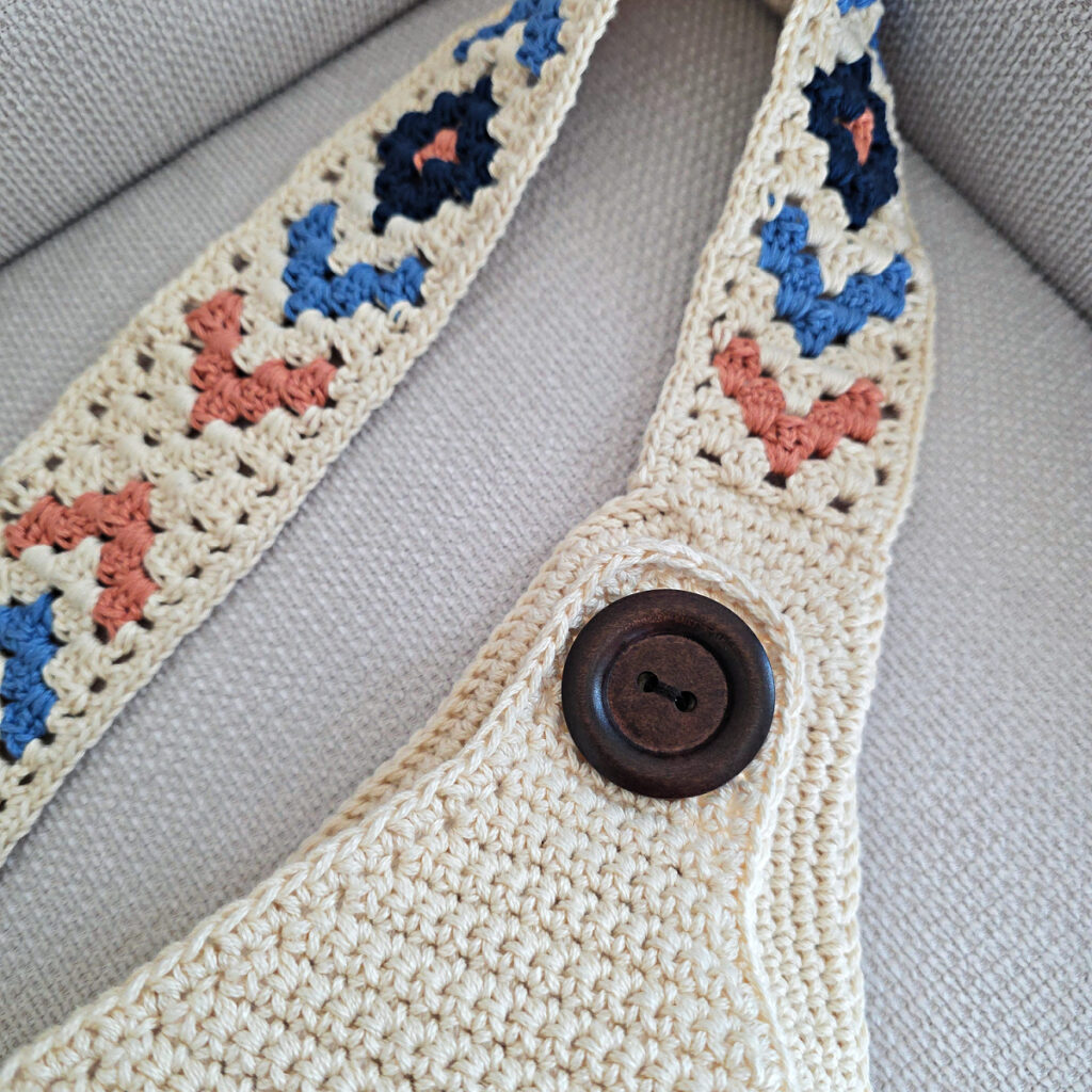 Attaching the button and strap to a crochet crossbody bag.