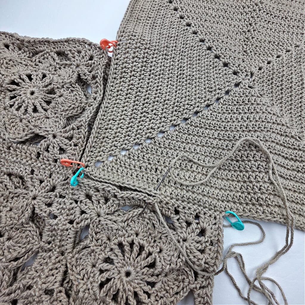 Attaching the bottom to a crochet granny square bag.