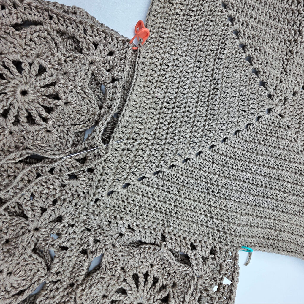 Attaching the bottom to a crochet granny square bag.