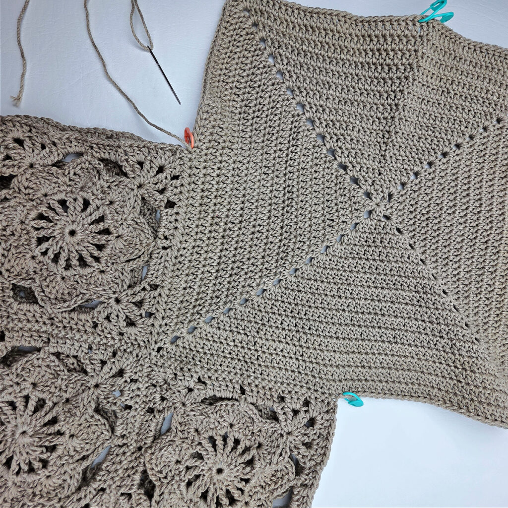 Attaching the bottom to a crochet granny square bag.