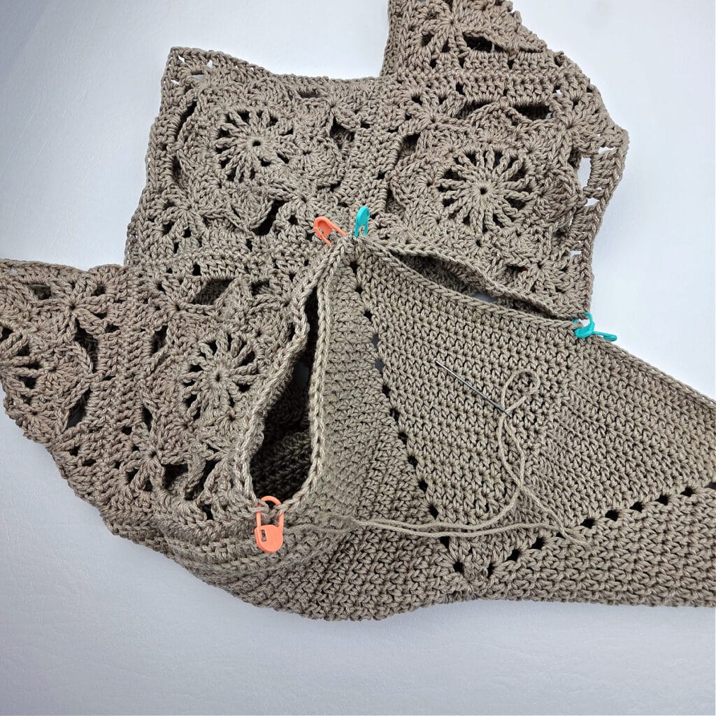 Attaching the bottom to a crochet granny square bag.