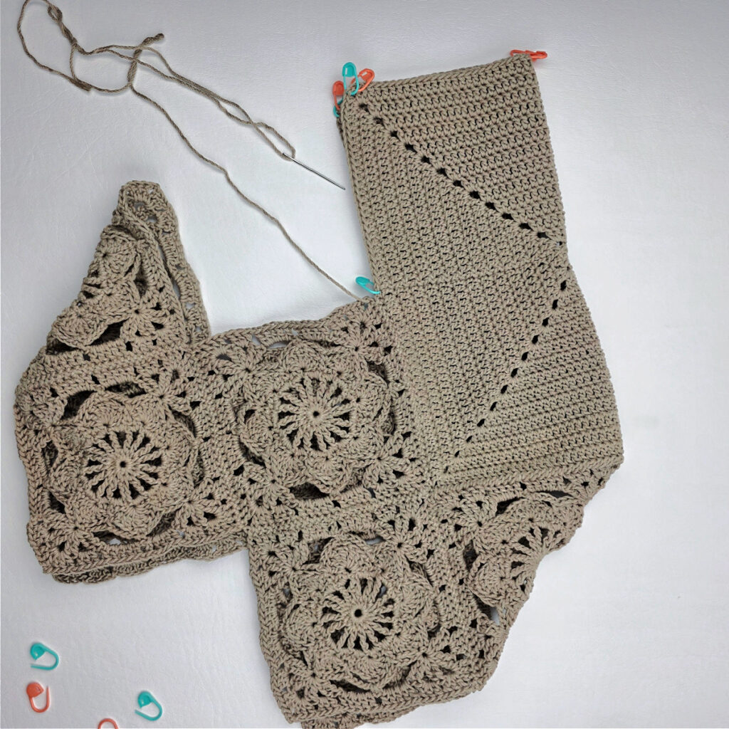 Attaching the bottom to a crochet granny square bag.