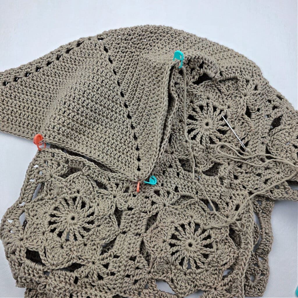 Attaching the bottom to a crochet granny square bag.