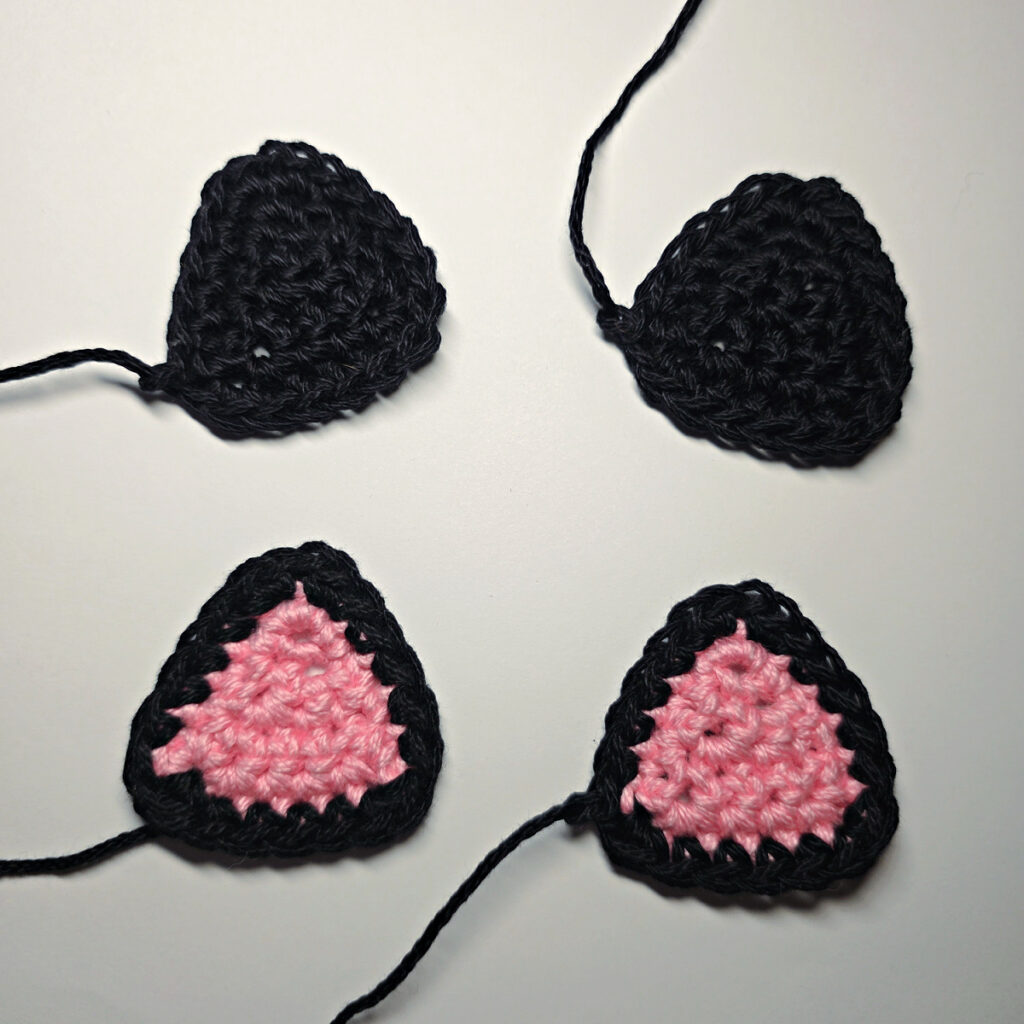 Ears of a crochet black cat.