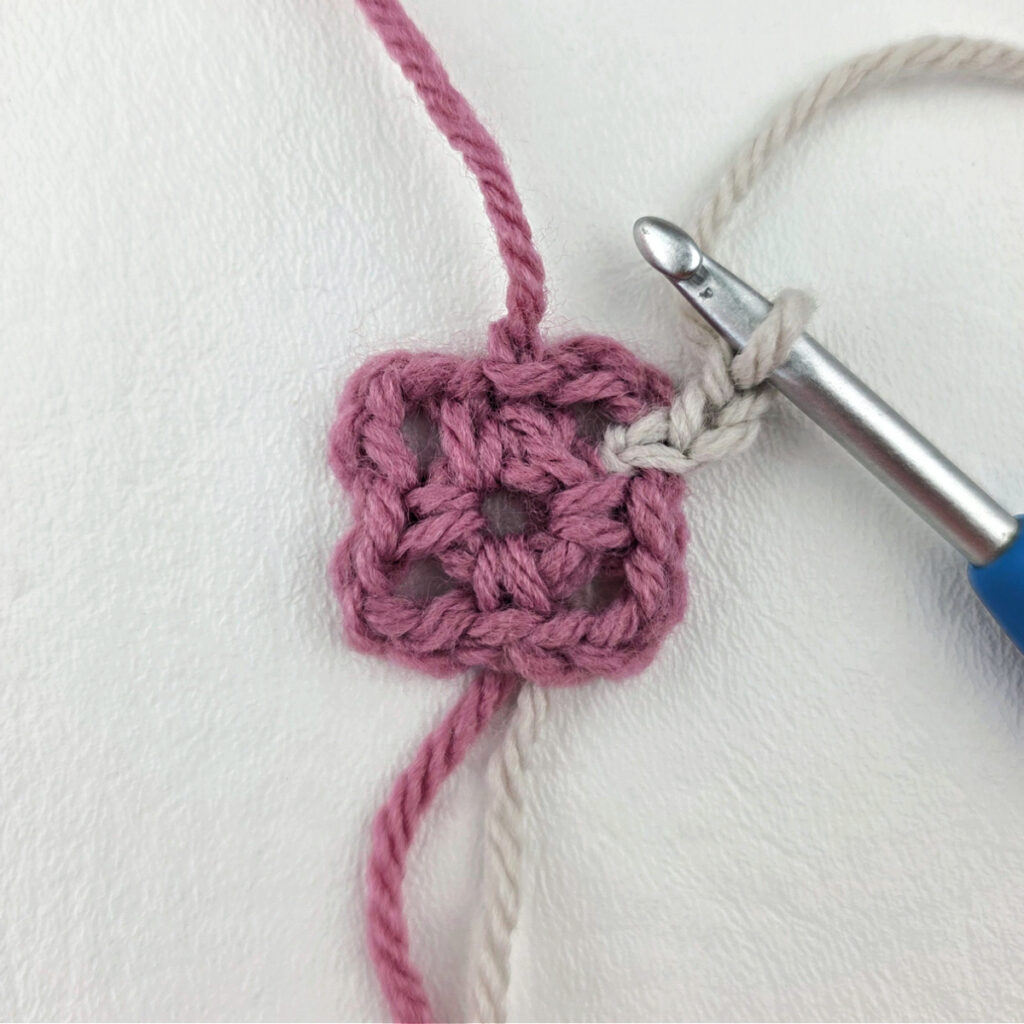 Making a block stitch granny square.