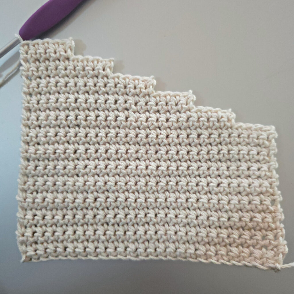 Making the body of a boho crochet crossbody bag.