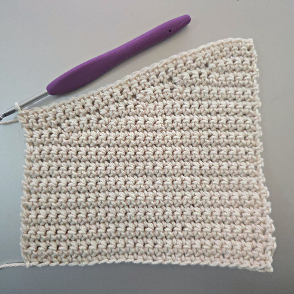 Making the body of a boho crochet crossbody bag.