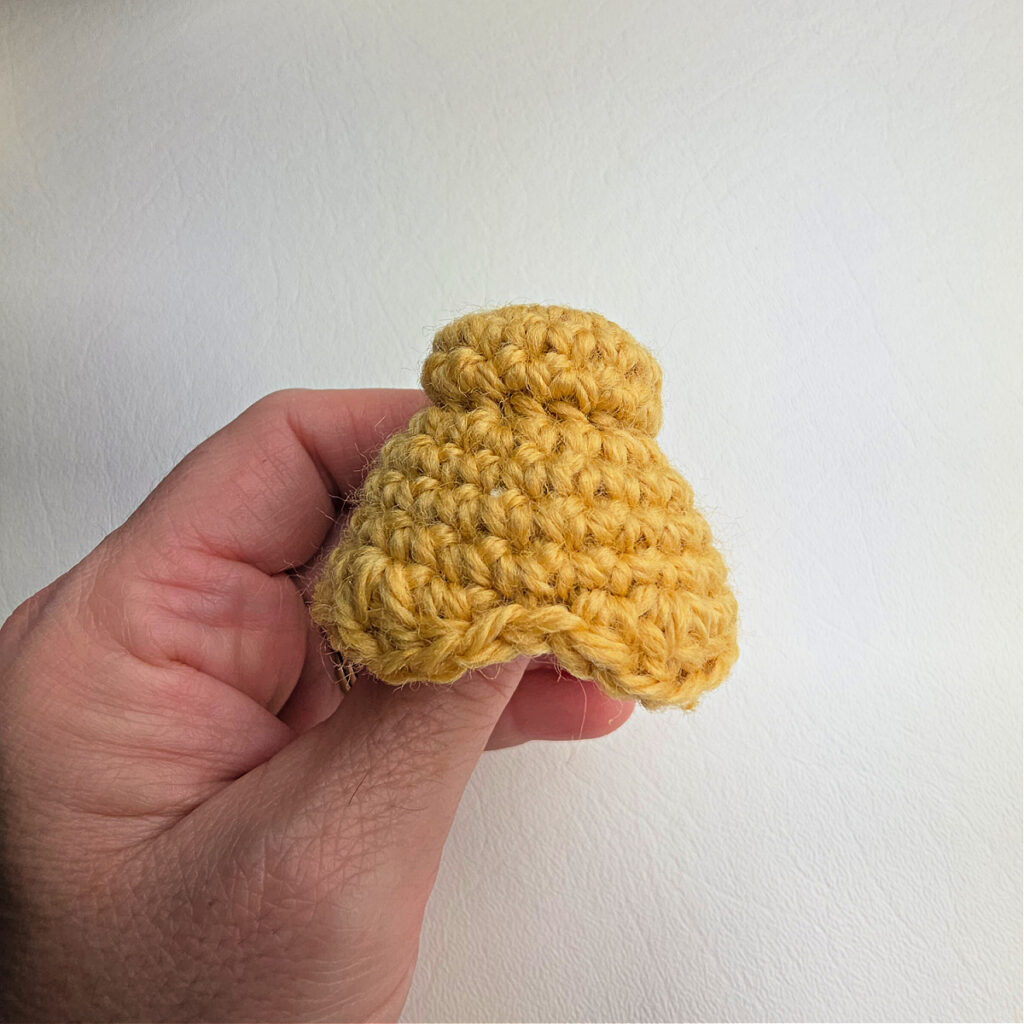 Golden hair bun for the crochet ballerina snow queen ornament.