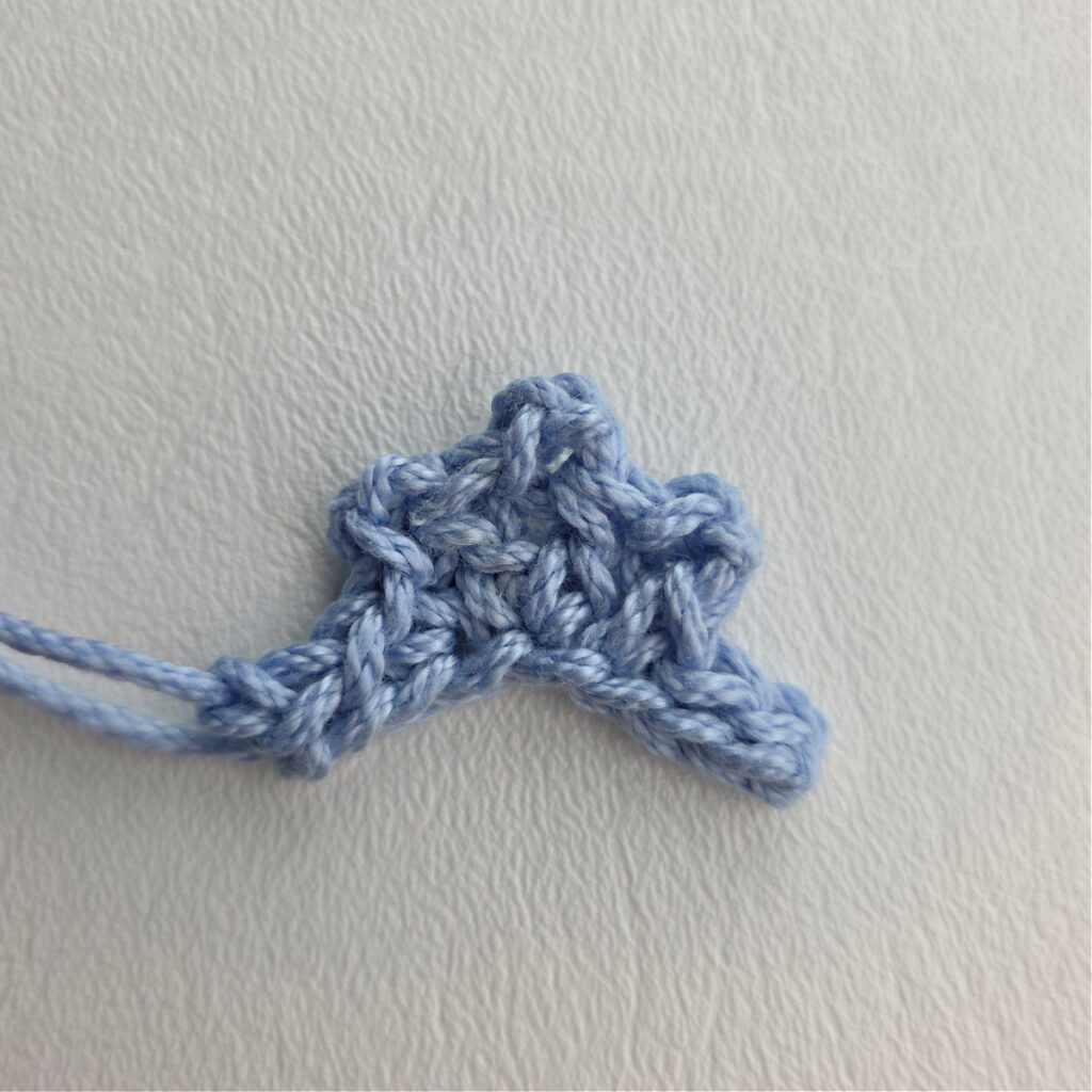 A small blue crochet tiara for the nutcracker snow queen ornament.