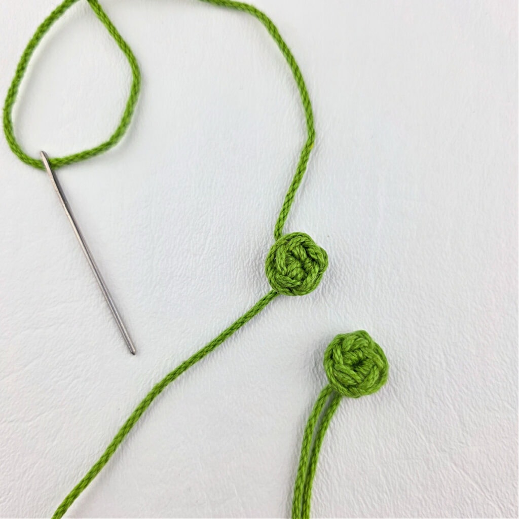 Two small green crochet circles.