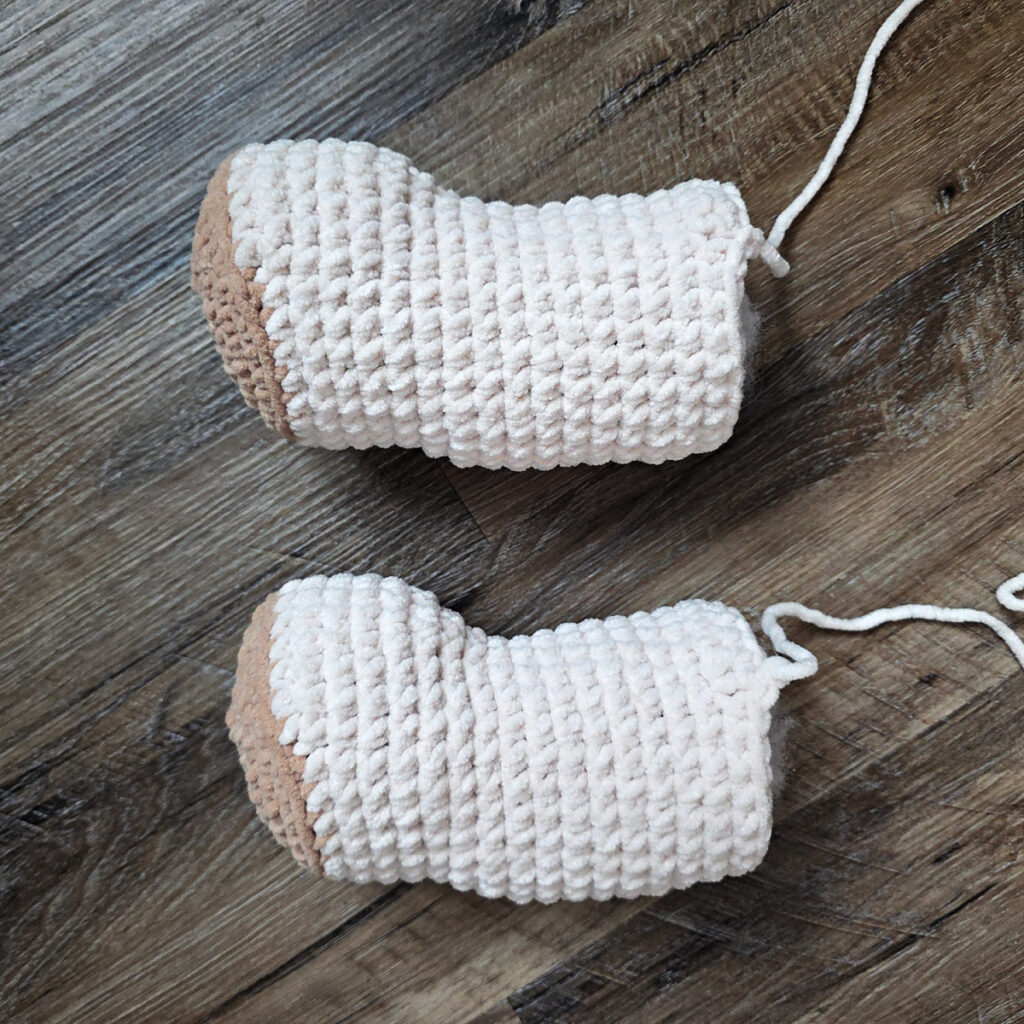 Back legs of a crochet dog amigurumi.