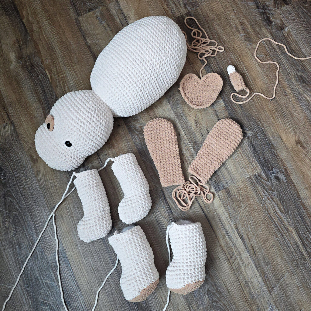 All of the completed parts of a crochet dog before seaming.