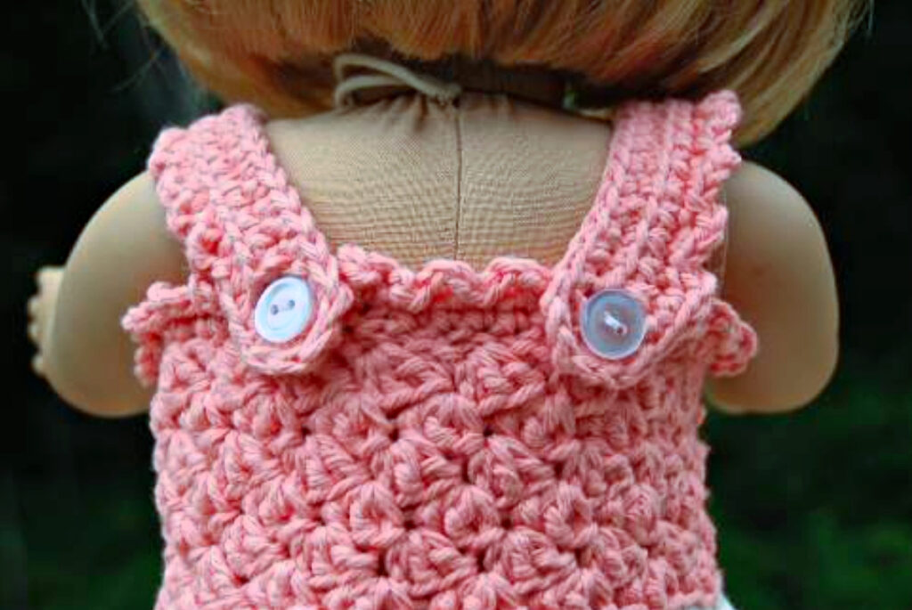 The back of a crochet doll dress.
